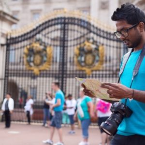 ndian visitor outside Buckingham Palace