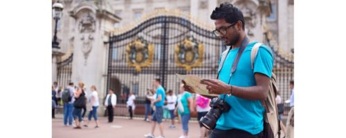 ndian visitor outside Buckingham Palace