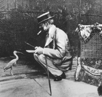 Baron Ferdinand feeding a bird at the Aviary,